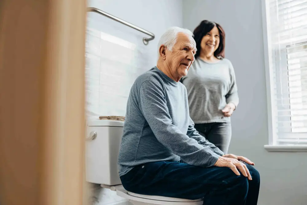 Dignified toileting assistance with professional caregiver support